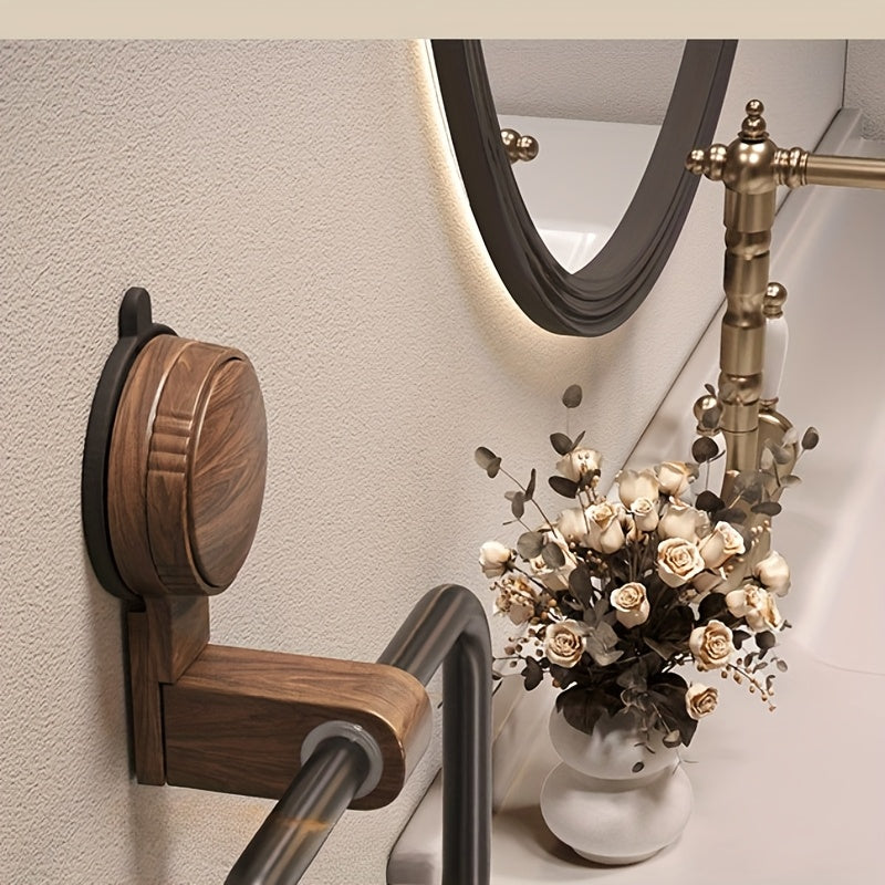 A Bathroom Towel Rack That Can Be Mounted on The Wall Without The Need for Drilling, Featuring a Sleek Frame And an Elegant Oval Shape, Perfect for Contemporary Bathrooms. Installation Is Easy with No Drilling Required. It Includes a Strong Suction