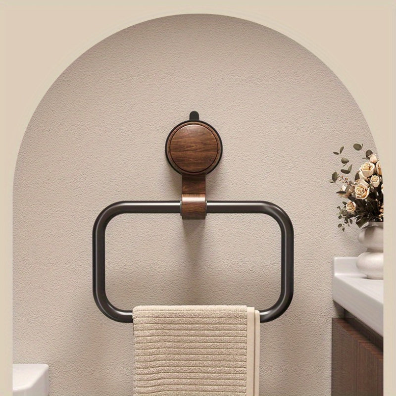 A Bathroom Towel Rack That Can Be Mounted on The Wall Without The Need for Drilling, Featuring a Sleek Frame And an Elegant Oval Shape, Perfect for Contemporary Bathrooms. Installation Is Easy with No Drilling Required. It Includes a Strong Suction