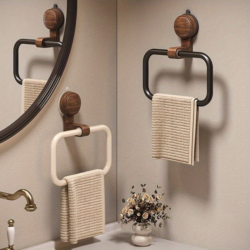 A Bathroom Towel Rack That Can Be Mounted on The Wall Without The Need for Drilling, Featuring a Sleek Frame And an Elegant Oval Shape, Perfect for Contemporary Bathrooms. Installation Is Easy with No Drilling Required. It Includes a Strong Suction